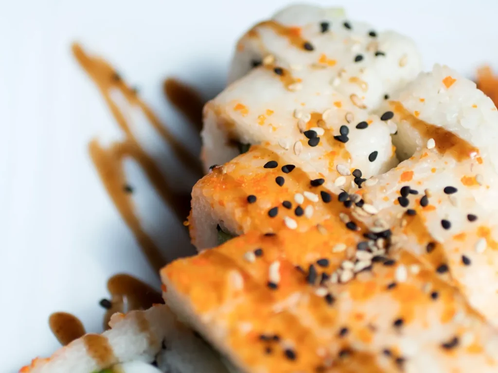 Hamachi collar recipe with soy sauce, sake, and mirin, served with sesame seeds and scallions