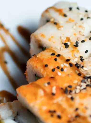 Hamachi collar recipe with soy sauce, sake, and mirin, served with sesame seeds and scallions