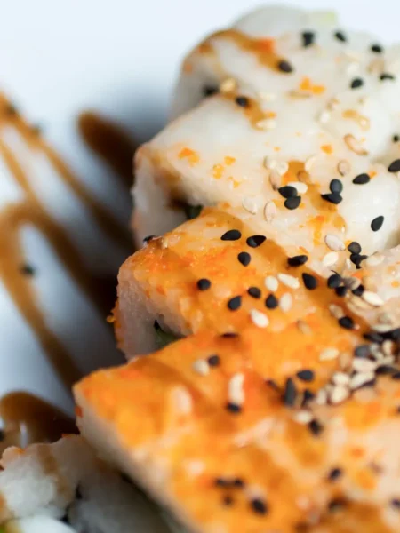 Hamachi collar recipe with soy sauce, sake, and mirin, served with sesame seeds and scallions
