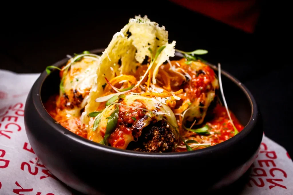 Meatball recipe without eggs, made with ground beef and pork, breadcrumbs, and cheese