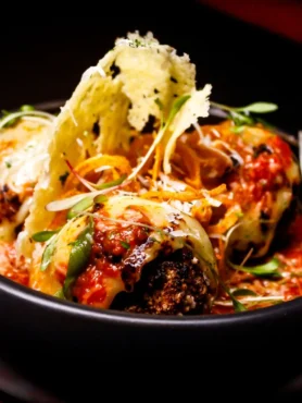 Meatball recipe without eggs, made with ground beef and pork, breadcrumbs, and cheese