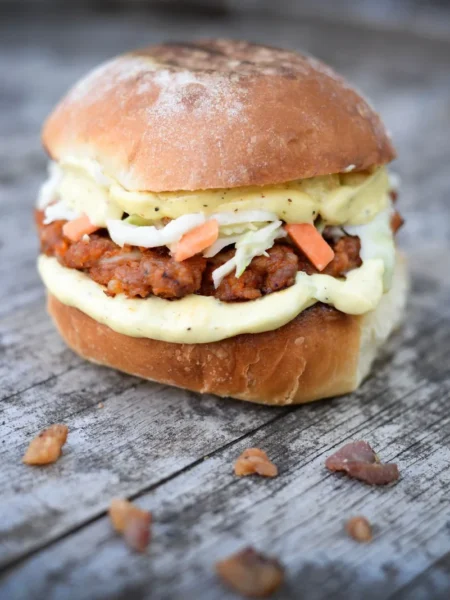 air fryer salmon burgers on toasted brioche buns with lemon dill mayo and cucumber slices