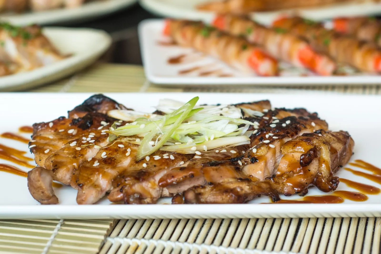 air fryer teriyaki chicken thighs with sticky glaze and sesame seeds