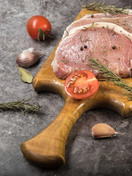 apple cider pork chops seared golden in a cast iron skillet with glossy cider glaze and thyme
