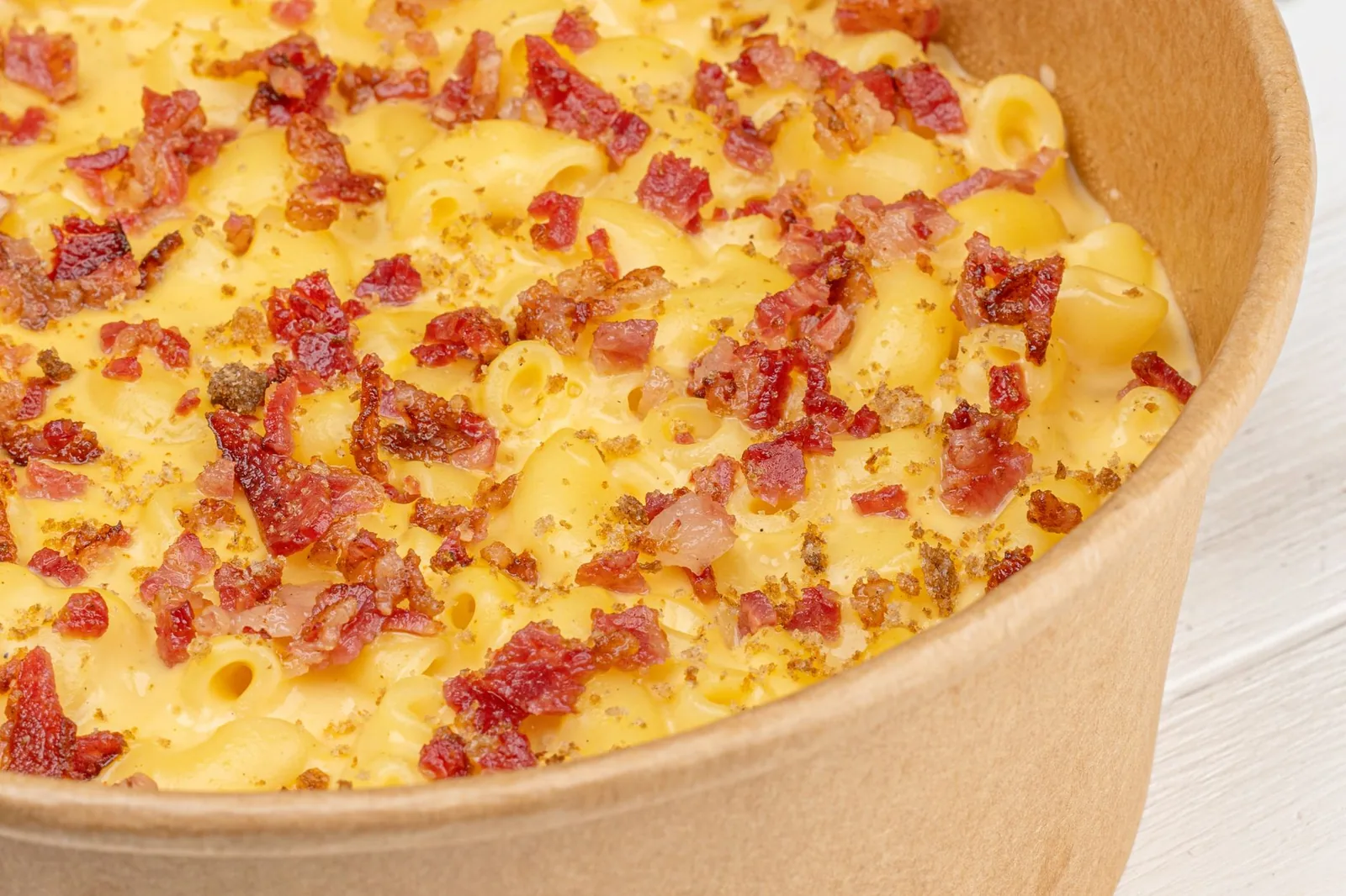 baked macaroni and cheese with golden crumb top in a dish