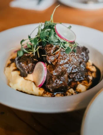 beef and noodles recipe over mashed potatoes
