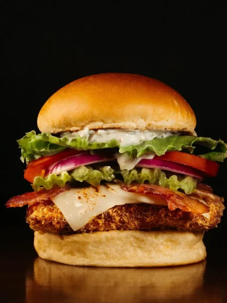 blackened chicken sandwiches with dark spiced crust, toasted brioche bun, and cabbage slaw