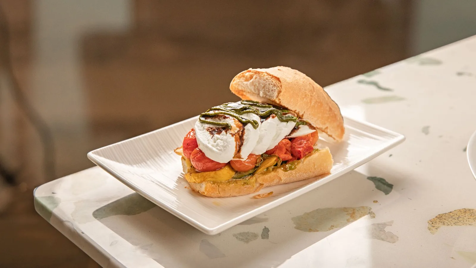 caprese sandwich with tomato mozzarella and fresh basil on bread