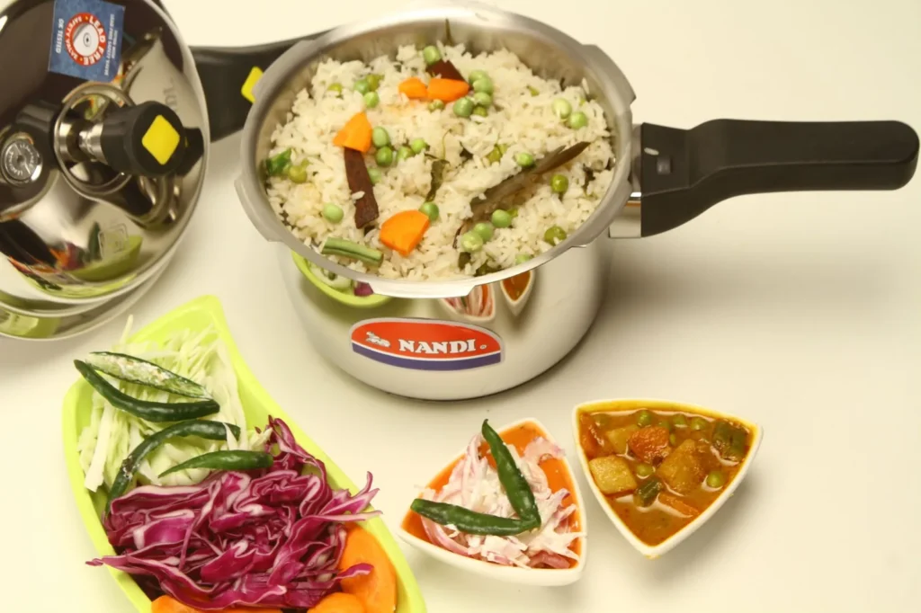 carrot rice recipe in a skillet with grated orange carrots, basmati rice, curry leaves, and crushed peanuts
