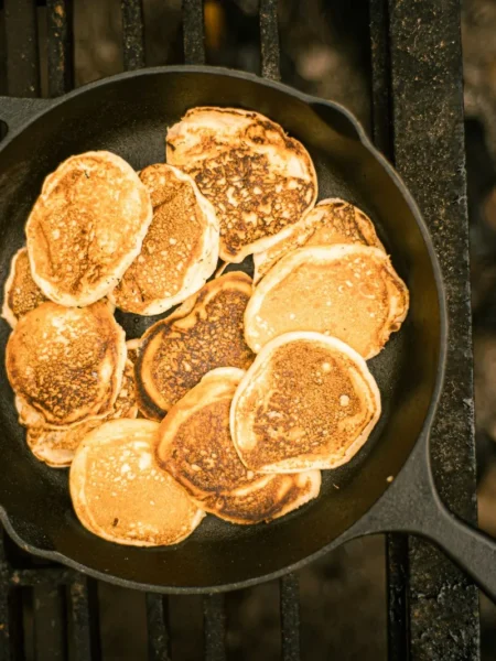 cast iron skillet buttermilk cornbread with a golden crisp top and tender crumb served in a black skillet