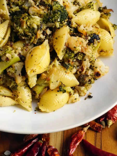 cavatelli pasta with broccoli in a skillet with garlic olive oil, pecorino, and crisp green florets