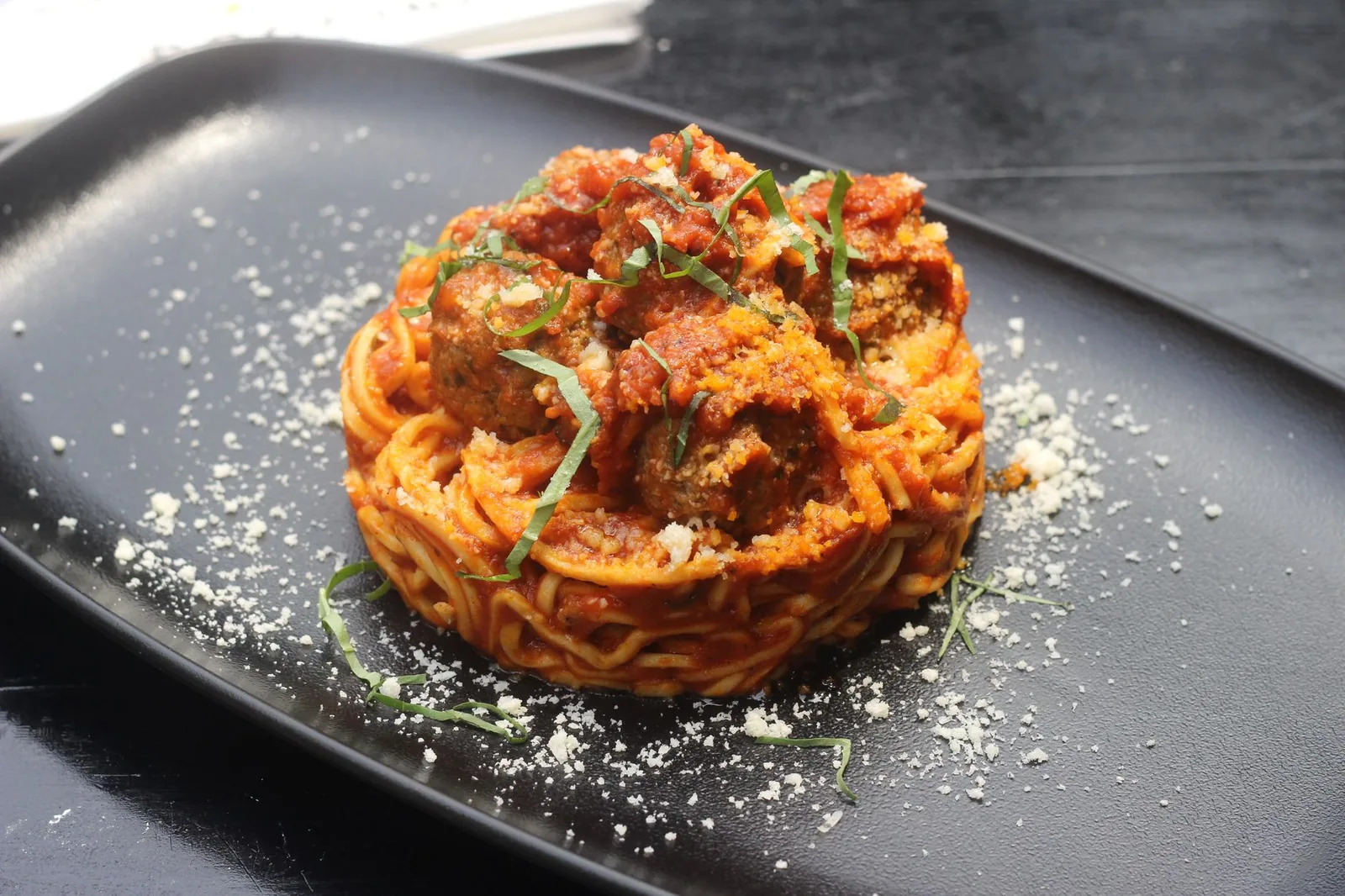 baked chicken parmesan meatballs with marinara and melted cheese