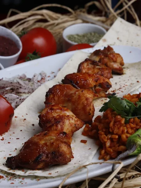 chicken spedini recipe with breaded chicken strips on skewers brushed with lemon butter and grilled golden on a tray