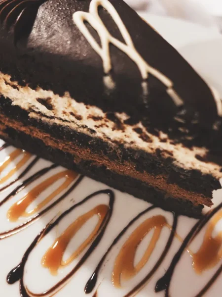 chocolate mousse pie recipe with silky dark filling and crisp wafer crust on a white plate
