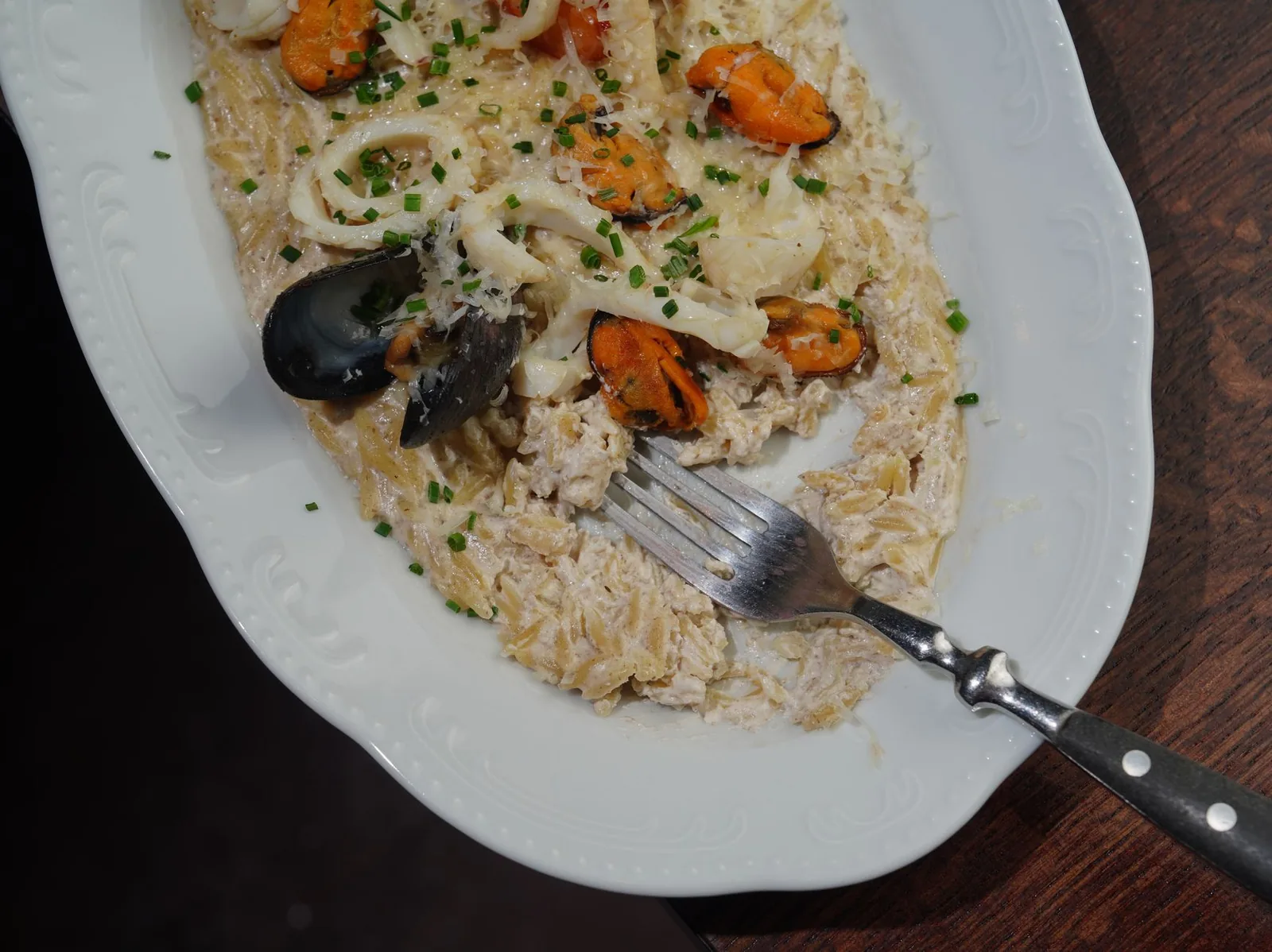 skillet of creamy chicken orzo with spinach and lemon