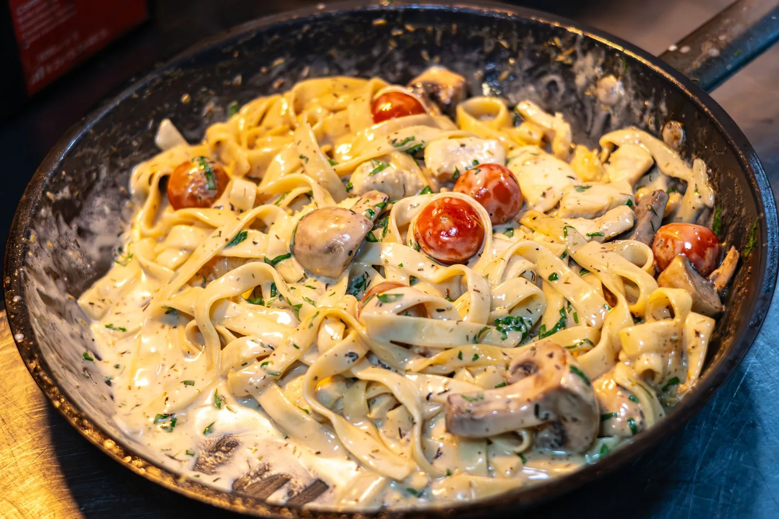 skillet of creamy italian sausage pasta with penne and parmesan sauce