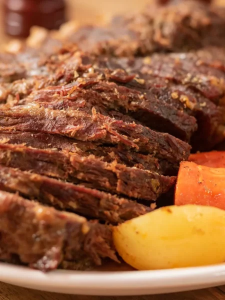 dutch oven red wine braised pot roast with fork-tender beef chuck, carrots, and parsnips in glossy red wine sauce