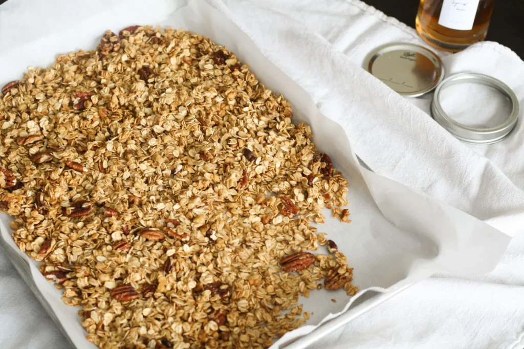granola bar recipe with oats and honey showing golden chewy oat bars with almonds cranberries and seeds on parchment