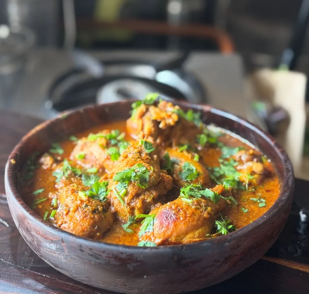 instant pot chicken curry recipe easy with tender chicken thighs in a thick coconut tomato sauce topped with cilantro