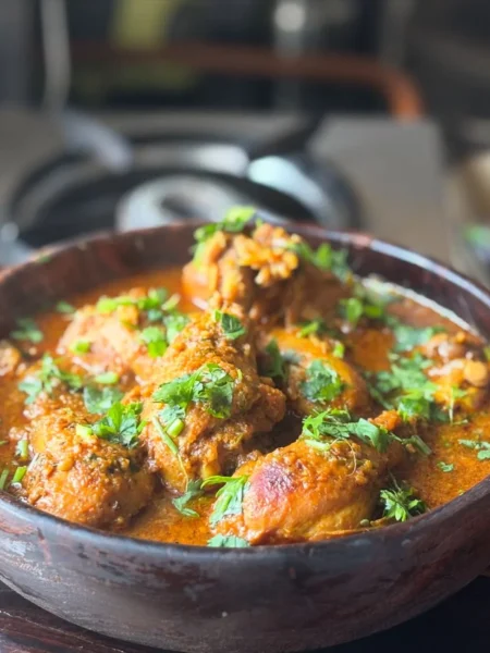 instant pot chicken curry recipe easy with tender chicken thighs in a thick coconut tomato sauce topped with cilantro