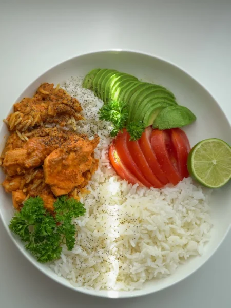 instant pot cilantro lime rice with fluffy white grains, green cilantro flecks, and lime zest in a bowl