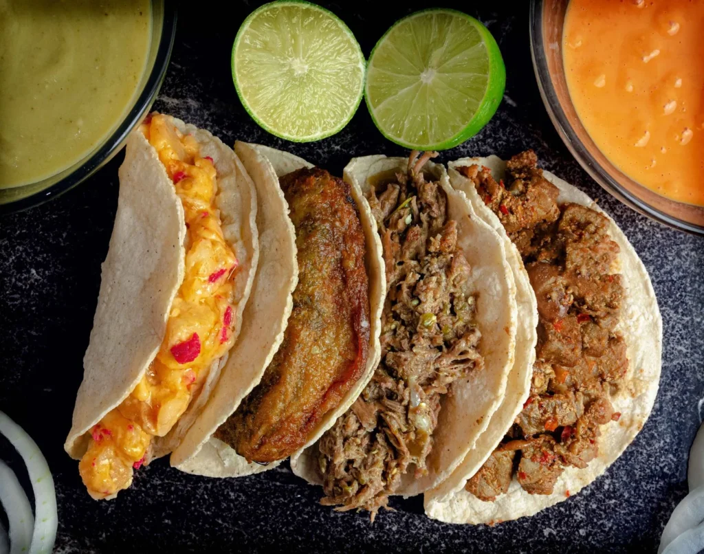 instant pot pork carnitas recipe for tacos with crispy citrus pork strands on warm corn tortillas and lime