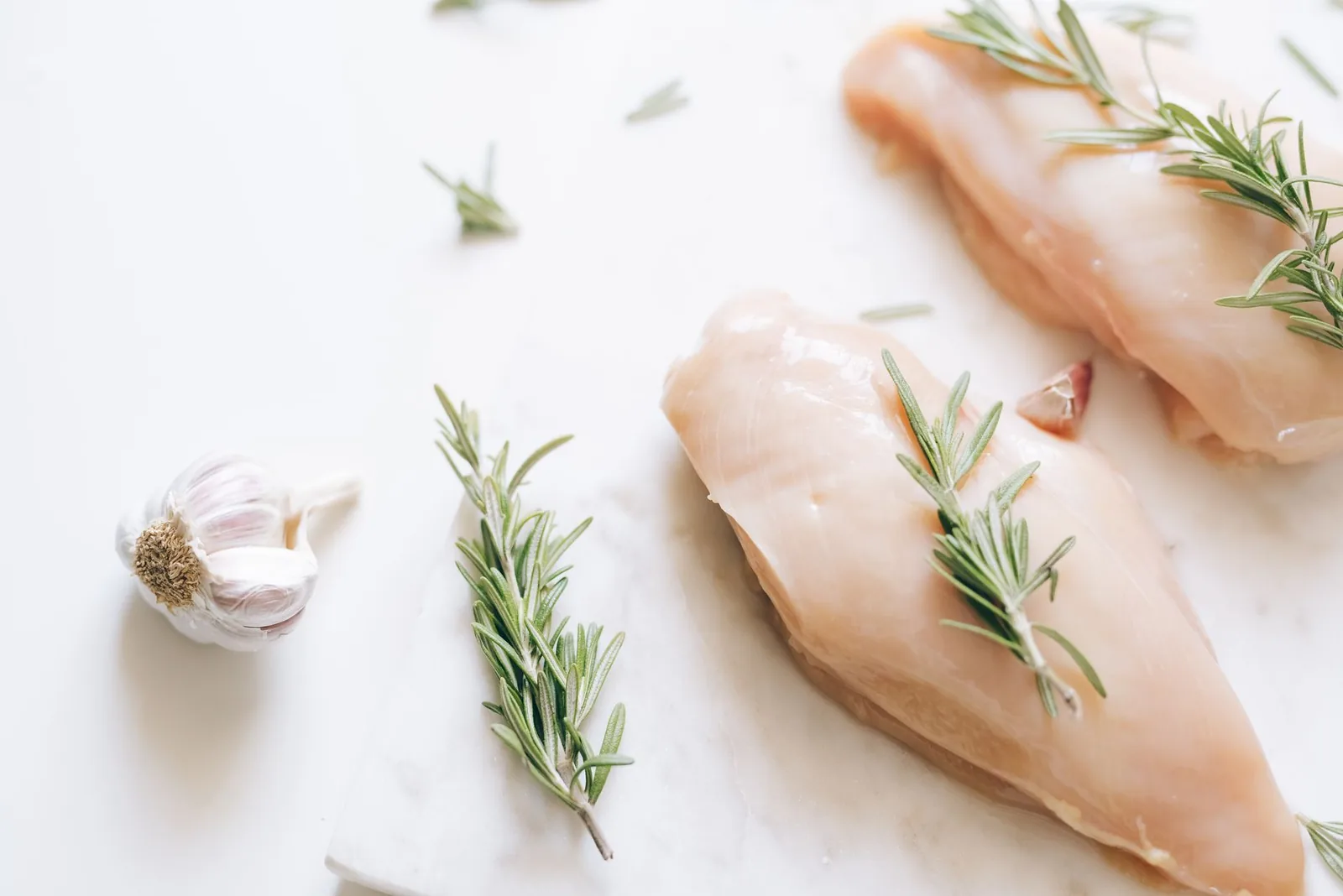 sliced instant pot turkey breast with thyme gravy on white platter