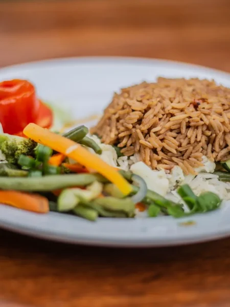 rice and beans recipe for budget meals in a pot with white rice, pinto beans, and cilantro