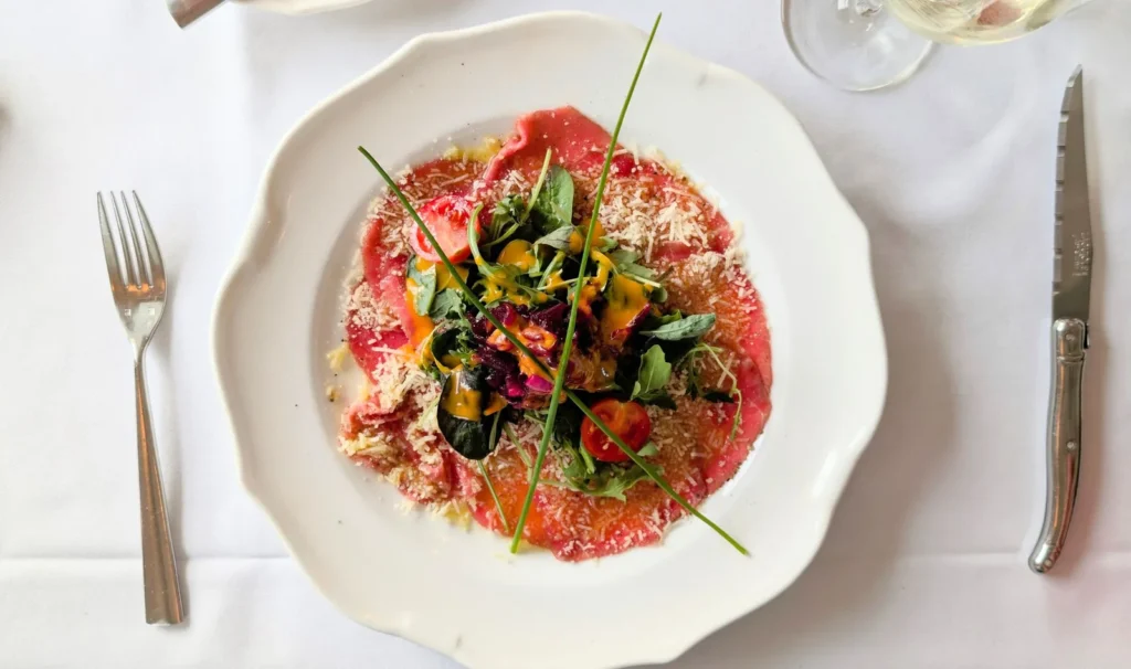 Sliced Beef With Tomatoes And Arugula