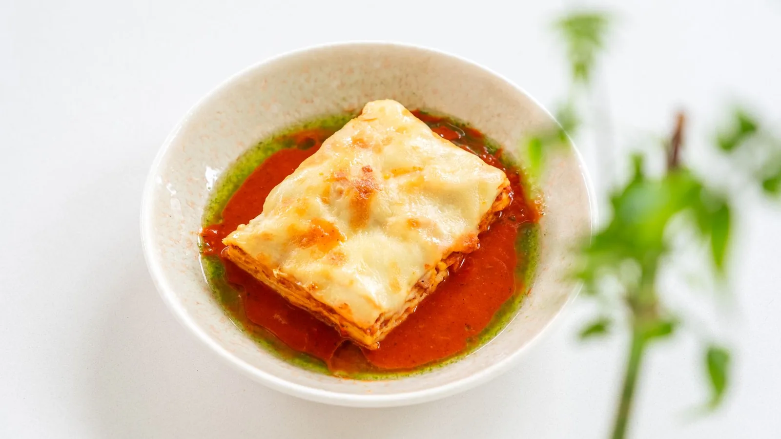 slow cooker lasagna soup with ricotta and mozzarella in bowl