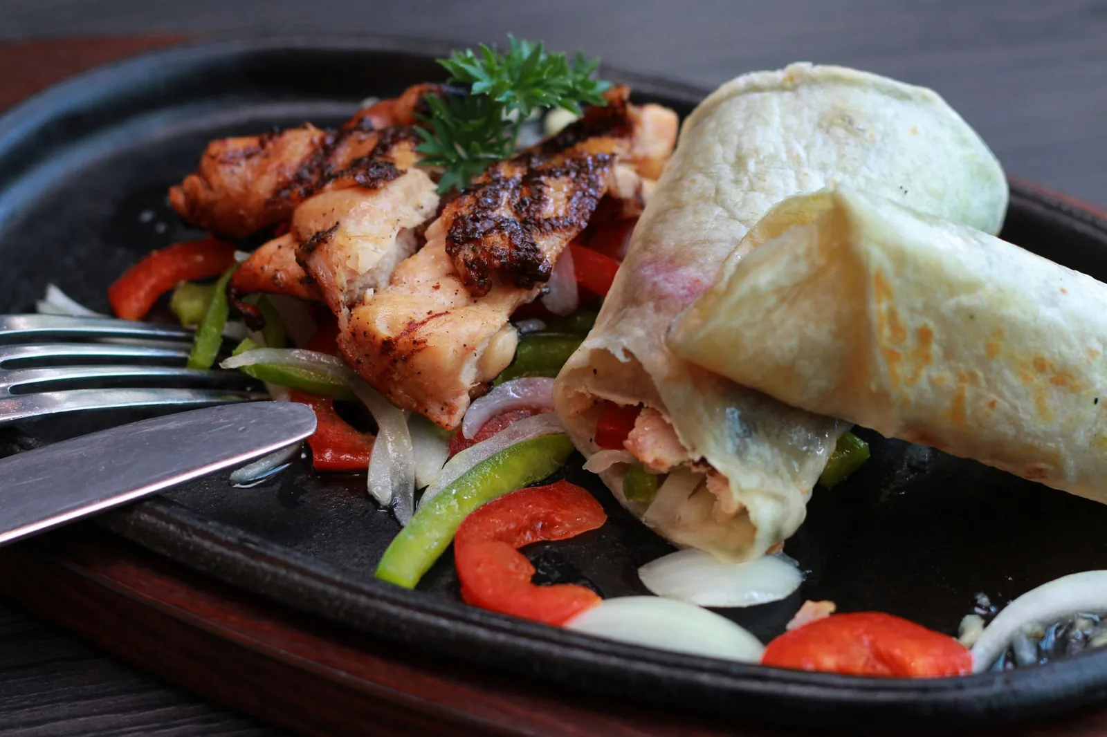 plated southwest chicken wrap with chicken beans and cheese